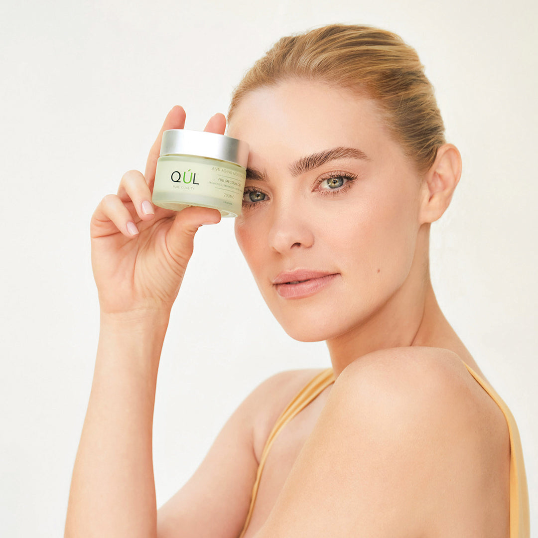 Model with QUL Beauty Anti-Aging Moisturizer