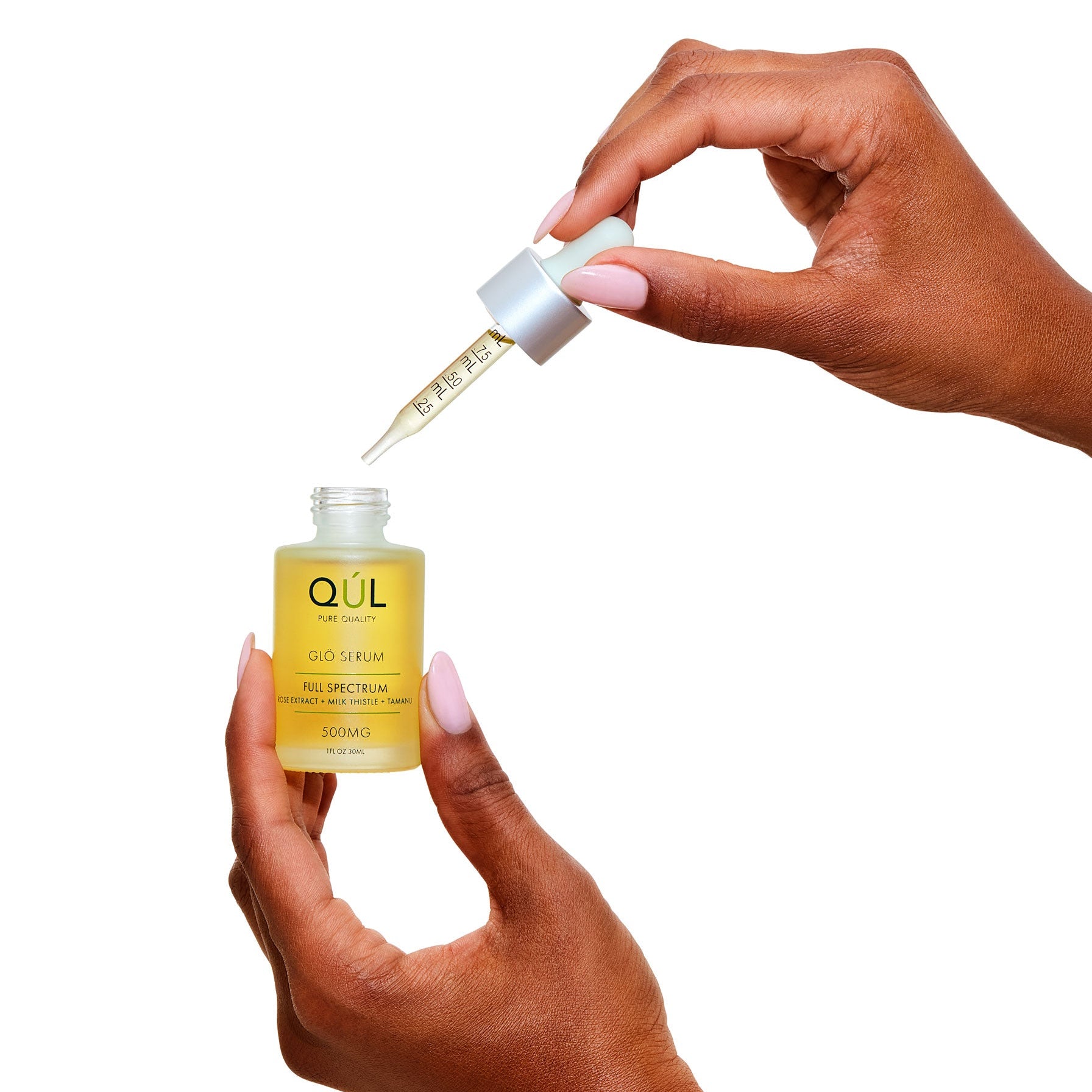 QUL Beauty Glo Serum botle in hands with dropper lid