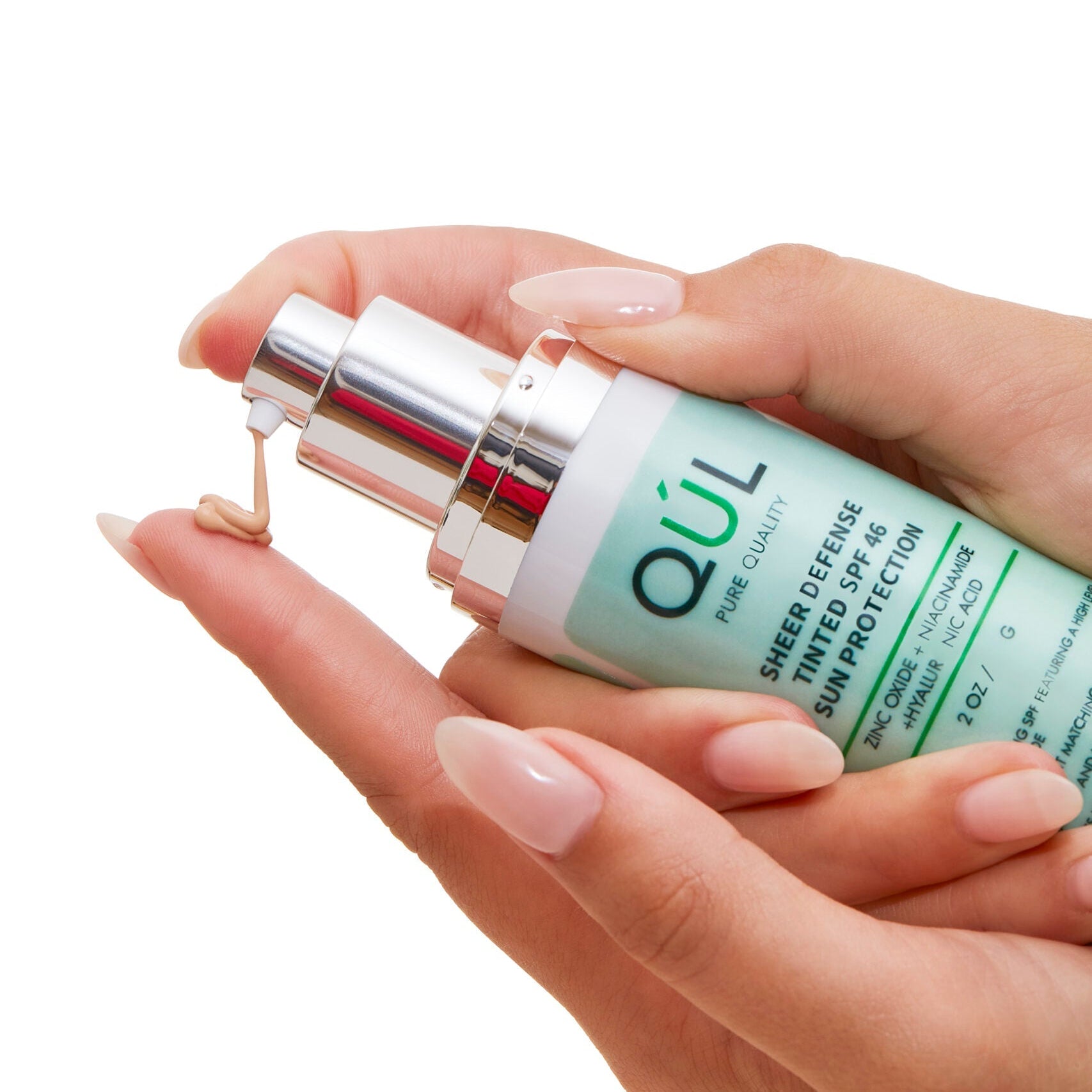 QUL Beauty Sheer Defense Sunscreen SPF 46 in model's hands
