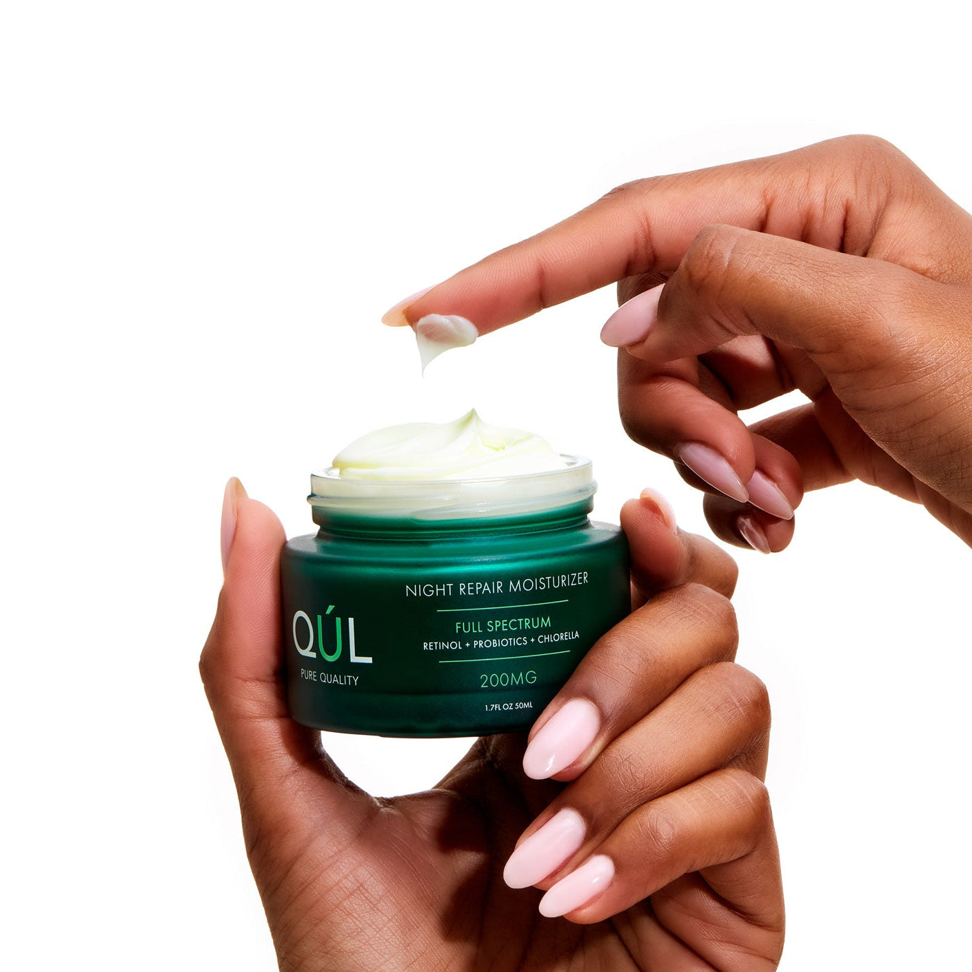 QUL Night Repair Moisturizer with model's hands